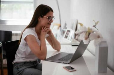 Businesswoman working from home. Young woman working on laptop.